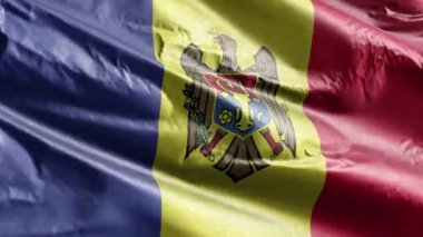 Moldova tekstil bayrağı rüzgâr çemberinde dalgalanıyor. Moldova bayrağı rüzgarda sallanıyor. Kumaş dokular. Tam dolgu arkaplanı. 10 saniye döngü. 