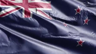Yeni Zelanda tekstil bayrağı rüzgâr çemberinde dalgalanıyor. Yeni Zelanda bayrağı rüzgarda sallanıyor. Kumaş dokular. Tam dolgu arkaplanı. 10 saniye döngü. 