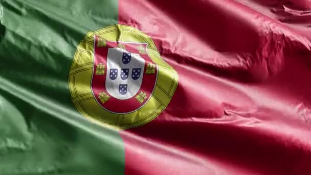 風の輪の上をポルトガルの繊維旗が振っている ポルトガルの旗が風に揺れる 繊維組織だ 完全充填の背景 10秒ループ — ストック動画