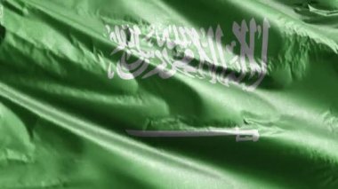 Suudi Arabistan tekstil bayrağı rüzgarda yavaşça dalgalanıyor. Suudi Arabistan bayrağı rüzgarda sallanıyor. Kumaş dokular. Tam dolgu arkaplanı. 20 saniye döngü. 