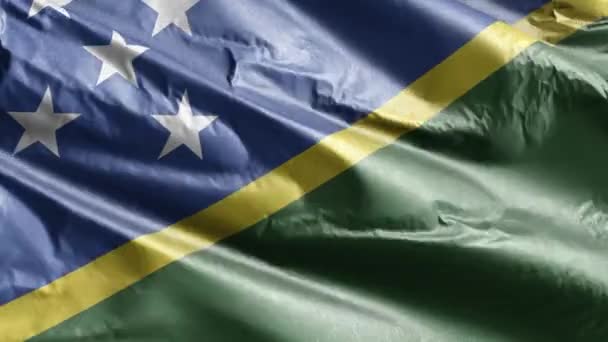 所罗门群岛的纺织品国旗在风环上飘扬 所罗门群岛的旗帜在微风中飘扬 织物织物织物组织 完整的背景 10秒回圈 — 图库视频影像