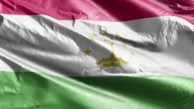 Tacikistan tekstil bayrağı rüzgar çemberinde dalgalanıyor. Tacik bayrağı rüzgarda sallanıyor. Kumaş dokular. Tam dolgu arkaplanı. 10 saniye döngü. 
