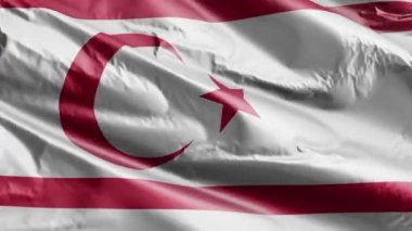 Kuzey Kıbrıs Türk Cumhuriyeti bayrağı rüzgâr çemberinde dalgalanıyor. Kuzey Kıbrıs Türk Cumhuriyeti bayrağı rüzgarda sallanıyor. Tam dolgu arkaplanı. 10 saniye döngü. 
