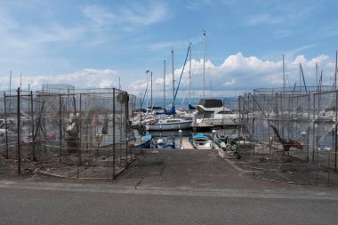 Fishing traps on the quay of the port and boat in Thonon les Bains in France