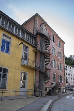 Architecture of colourful houses with spiral staircases in the town of Saint Claude