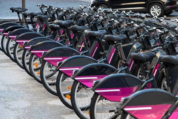 Parked electric bikes for rent in the city of Dijon, France