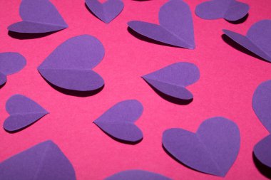 A Pink and Purple Paper Love Hearts Cut Out for Background for Valentines Day or Weddings