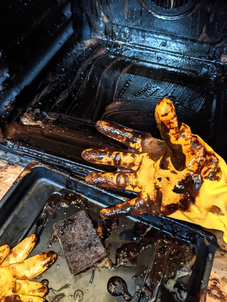 Filthy Greasy Oven Being Cleaned Yellow Rubber Gloves — Foto de Stock