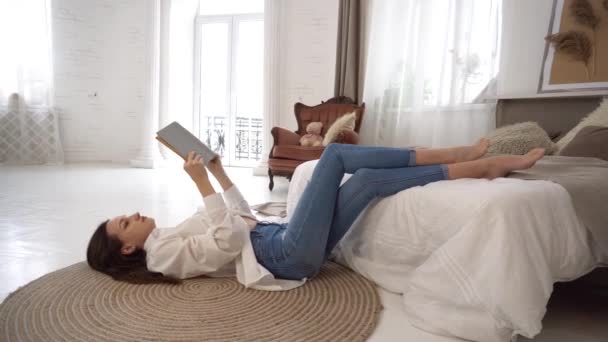 Beautiful Woman Enjoys Reading Book Her Bedroom — 图库视频影像
