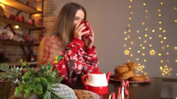 Girl Christmas Decorated Kitchen Drinking Coffee — Stockvideo