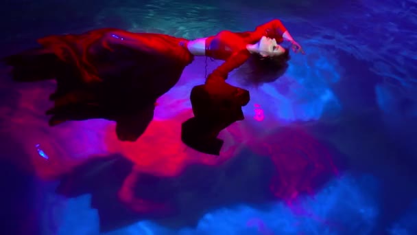 Slow Motion Attractive Young Woman Swims Beautifully Underwater Red Dress — Stock video
