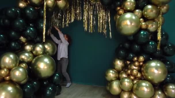 Slow Motion Little Boy Posing Decorated Studio Balloons — Video