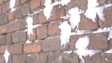 Slow Motion Snowballs thrown into a red brick wall. Play snowballs. Child Game.