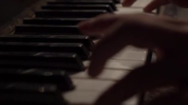 Piano player. Pianist hands playing grand piano keys. Music instrument close up