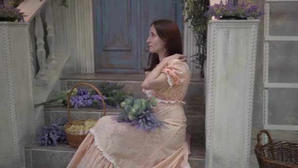 Young Woman Simple Dress Sitting Lavender — Video