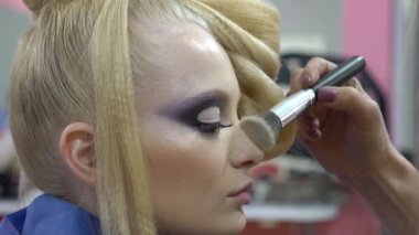 Slow Motion Makeup artist making professional makeup 