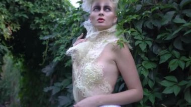 4K portrait of pretty blonde girl with fashion look, creative modern hair-style