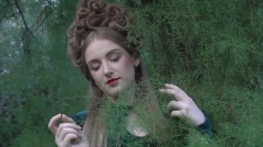 Creative portrait of female model with creative make-up and hairstyle