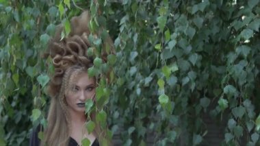 Slow Motion portrait of Beautiful romantic girl with perfect hairstyle in garden