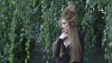 Fairy-tail forest nymph beautiful sexy woman at spring garden