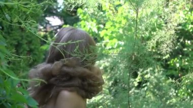 Portrait of beautiful girl on colorful forest glade