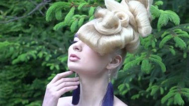 Slow Motion Model blonde Woman with perfect hairstyle and creative hair-dress