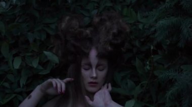Slow Motion mystic style fabulous forest with nymph long dark black hair 