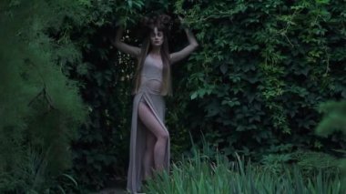 Slow Motion mystic elf in dress in forest