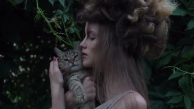 Slow Motion mystic style fabulous forest with nymph long dark hair with a cat 