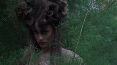 Slow Motion Forest fairy beautiful girl with long hair in spring forest 