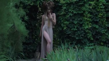 Brunette girl Mavka Dryad Naiad forest nymph in a fairy tale