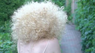 Slow Motion Perfect woman with curly hair portrait