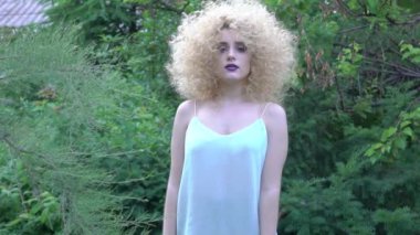 Slow Motion Beautiful girl is smiling. Afro curly hair