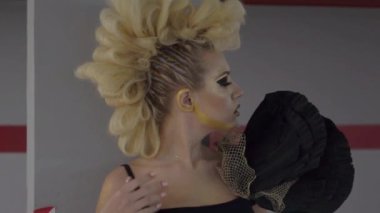 Slow Motion girl with a mohawk hairstyle in the parking lot