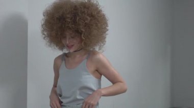 Slow Motion Beautiful happy woman with curly hair
