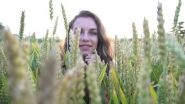 Slow Motion A languid female glance through wheat field