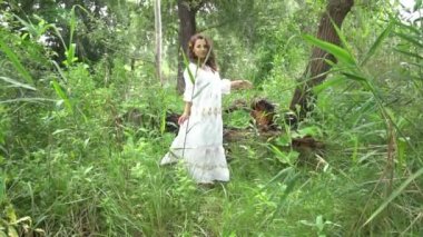 Slow Motion Sensual girl in forest or park.