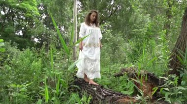 Slow Motion Beautiful young woman walking in park