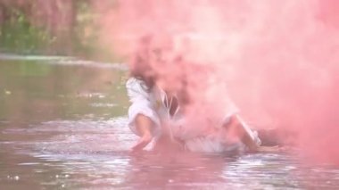 Slow Motion Fantasy woman river nymph in white dress. Background fog lake 