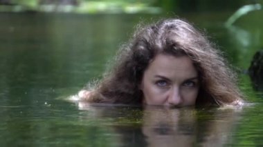 Slow Motion girl looking from water