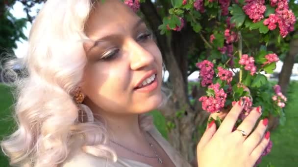 Woman Blonde Hair Trees Blossoming Garden Holding Tree Branch — Vídeos de Stock