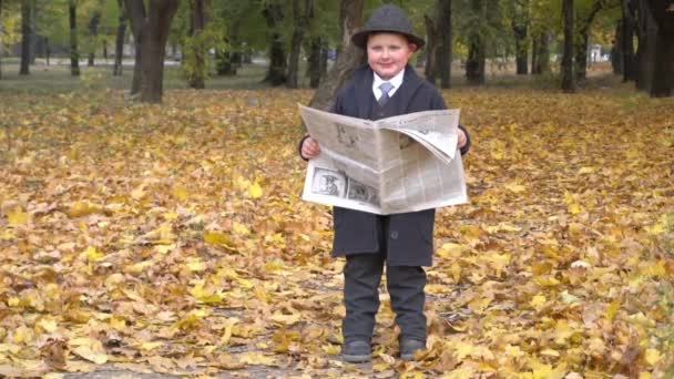 Slow Motion Young Business Man Reading Newspaper Autumn Park — Stok video