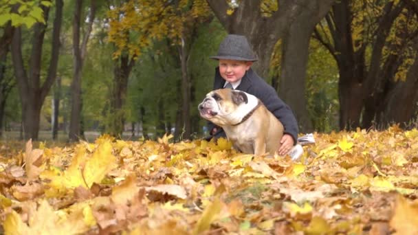 Slow Motion Boy Black Suit Playing Fun Dog Bulldog Autumn — Stockvideo