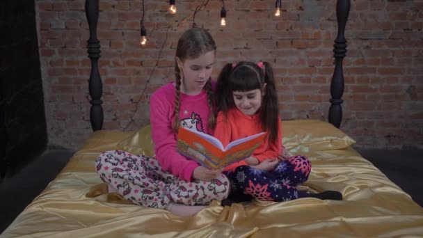 Cute Little Sisters Reading Book Bedroom — Video