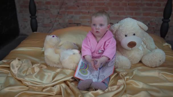 Cute Child Toddler Girl Reads Book Bed Bedroom — Vídeo de Stock