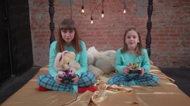 Joyful Girls Playing Console Bedroom — Stockvideo
