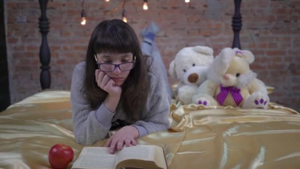 Girl Reading Book Bed Home — Vídeos de Stock