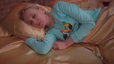 4K beautiful woman sleeping alone in big bed at night