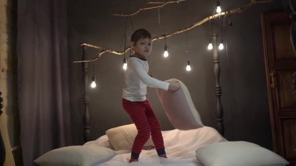 Adorable Boy Playing Pillow Bed Home — Stock videók