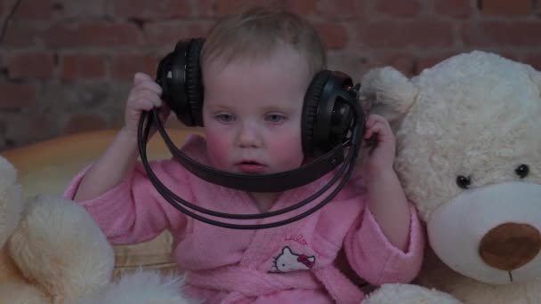 Slow Motion Little Girl Headphones Listening Music — Stockvideo